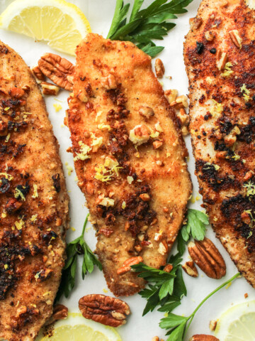 3 fillets of pecan crusted tilapia topped with chopped pecans, lemon zest and parsley