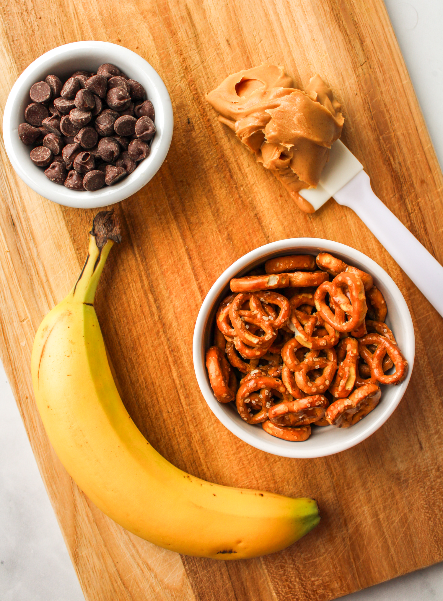 ingredients for pretzel bites laid out on a wooden cutting board