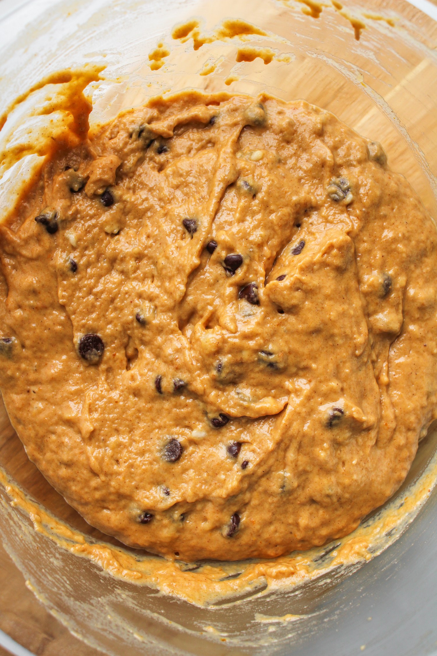 pumpkin banana chocolate chip muffin batter in a bowl