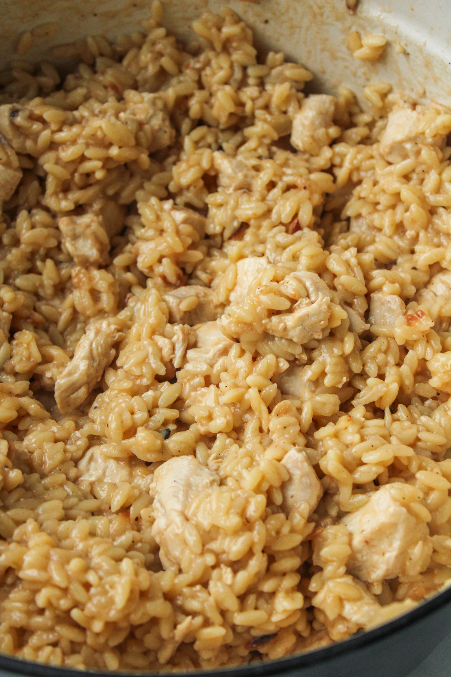 cooked orzo and chicken in a large pot