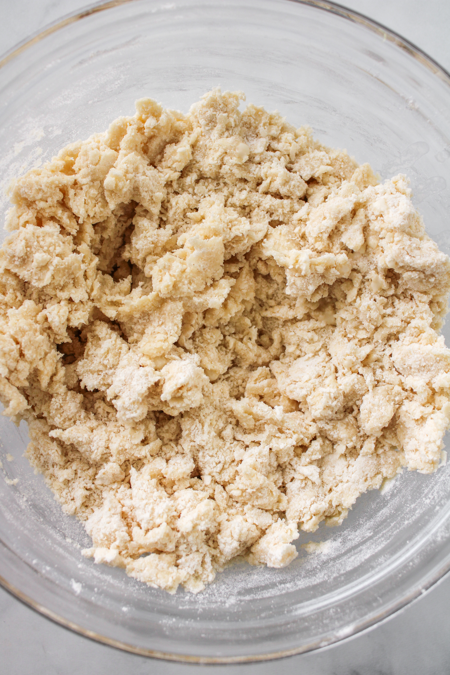 crumbled scone batter in a large glass bowl