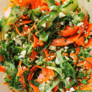 cucumber carrot salad in a large glass bowl