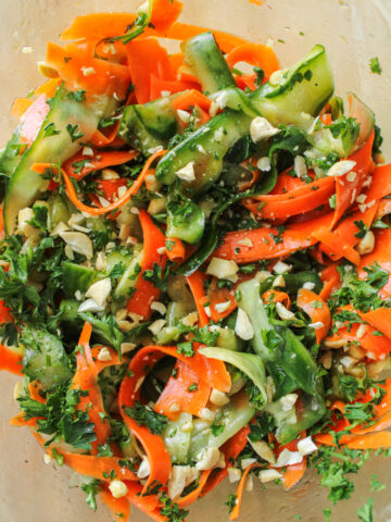 cucumber carrot salad in a large glass bowl