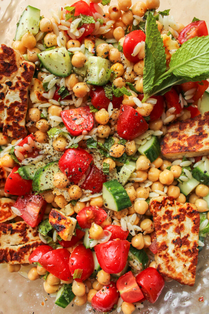 overhead shot of chickpea and halloumi salad with chili oil vinaigrette