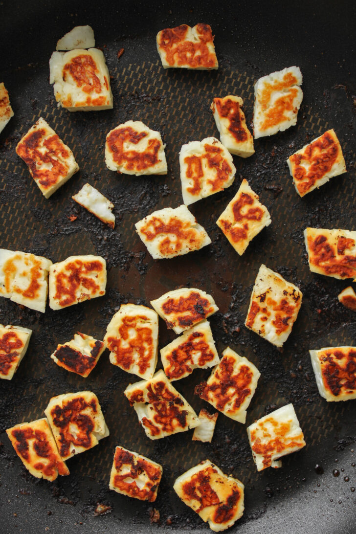 grilled halloumi pieces on pan