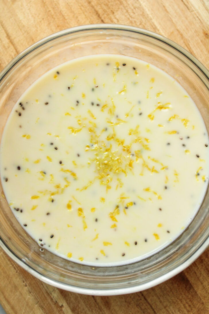 chia seeds, milk and lemon zest in a glass bowl