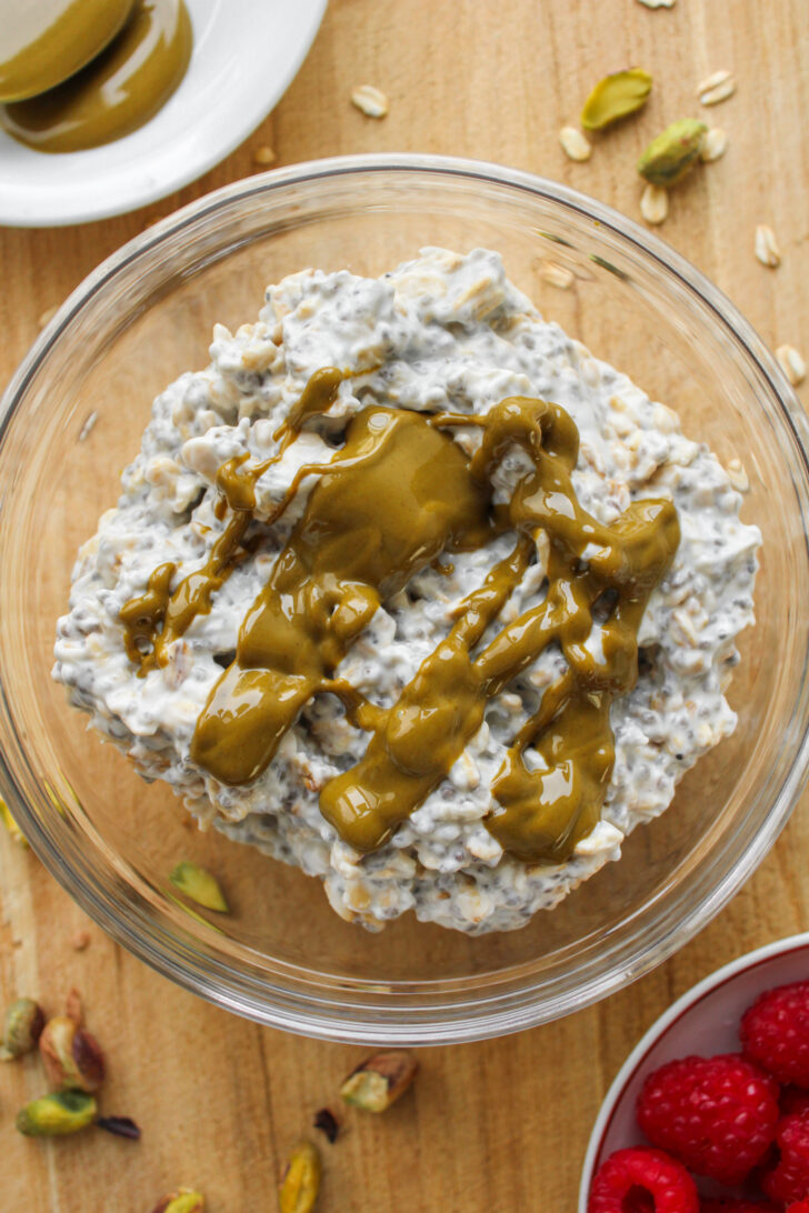 oats and chia mixture with pistachio butter drizzled on top