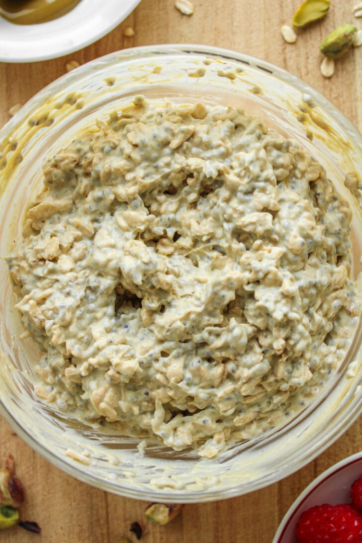 oats and chia mixture with pistachio butter mixed into it