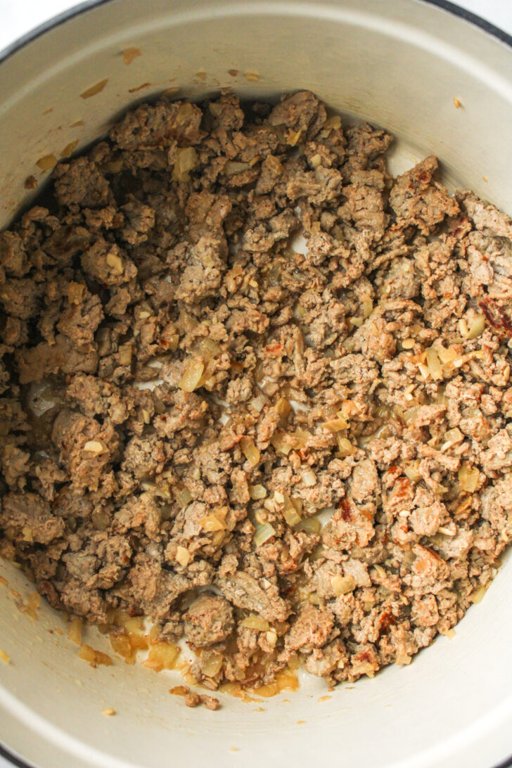 ground turkey in a beige ceramic pot