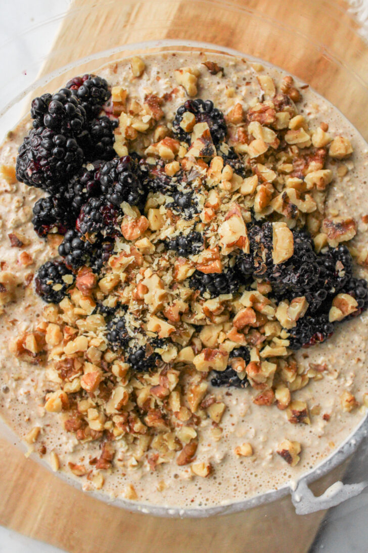 oatmeal batter with blackberries and chopped walnuts
