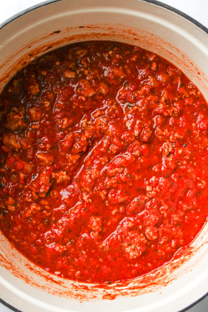 ground turkey and tomato sauce in a large pot